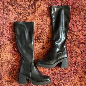 Knee high platform heeled black boots